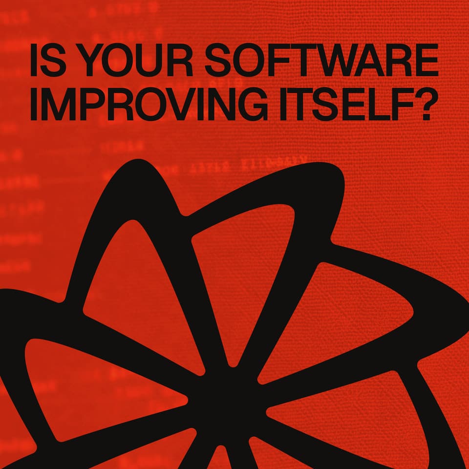 Factory booth back wall reading "Is your software improving itself?" with the Factory rotor